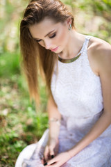 Naklejka premium portrait of young woman in the forest