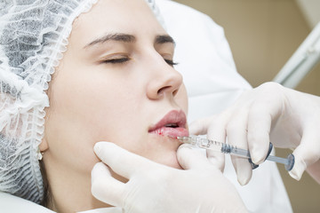 young girl in a clinic contour lips procedure