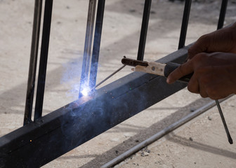 worker welding door frames