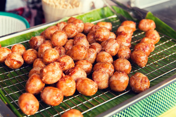 fried meatballs sale at street market