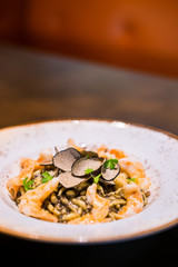Restaurant trofie pasta with truffle pesto and prawns