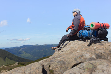 Fototapeta premium Hiking in the mountains in the summer on a sunny day.
