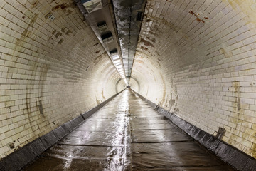 The Greenwich Foot Tunnel crosses beneath the River Thames, linking Greenwich in the south with the...
