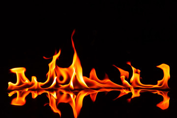 Fire flames and shadow on black background.