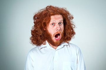 Portrait of young man with shocked facial expression