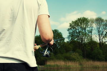 Young man fishing in the river