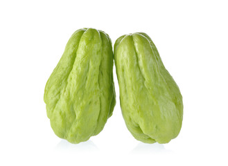 uncooked whole fresh chayote on white background