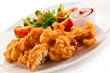 Fried chicken nuggets and vegetables