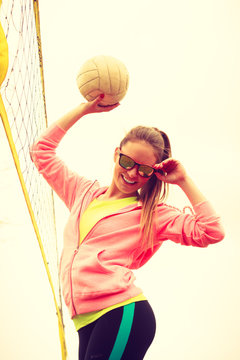 Woman volleyball player outdoor on court