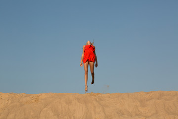 Happy Girl jumping on the beach 