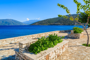 Promenade along a beautiful sea on coast of Kefalonia island in Agia Efimia, Greece