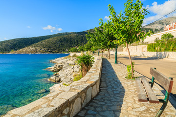 Coastal promenade along a sea on coast of Kefalonia island in Agia Efimia, Greece