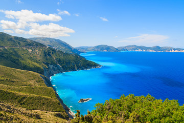 Fototapeta na wymiar Blue sea and mountains on coast of Kefalonia island near Assos town, Greece