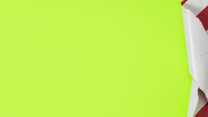 Christmas gift unwrapping revealing a green screen.