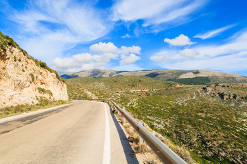 Scenic coastal road in mountain landscape of Kefalonia island, Greece