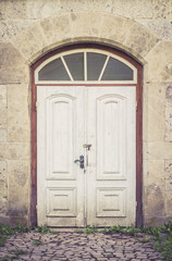 Fototapeta na wymiar Old distressed white doors