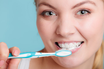woman with toothbrush brushing cleaning teeth