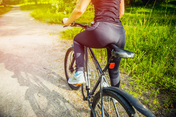 Naklejka premium Athlete woman is running with her extreme mountain bike outdoors