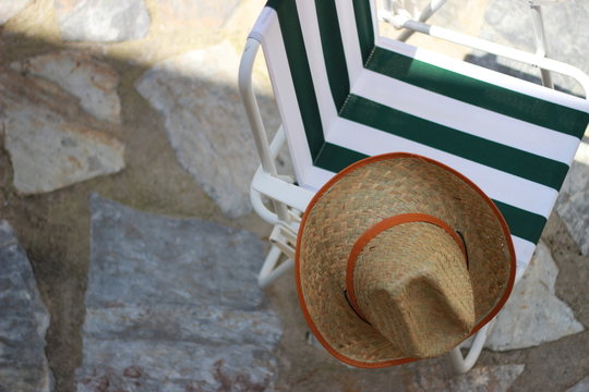 deck chair and straw hat 