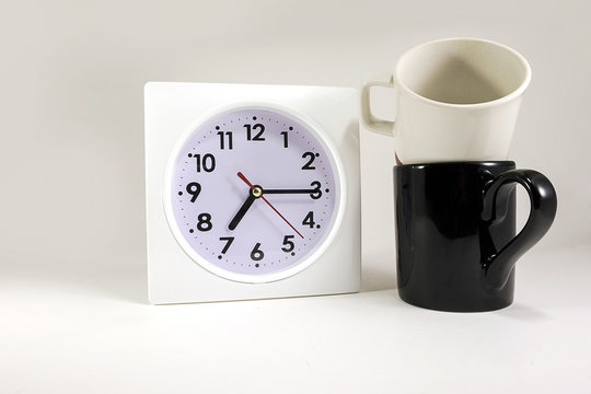 clock with pair cup on isolated background