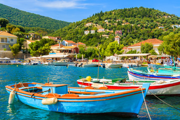 Colorful Greek fishing boats in port of Kioni on Ithaka island, Greece - obrazy, fototapety, plakaty