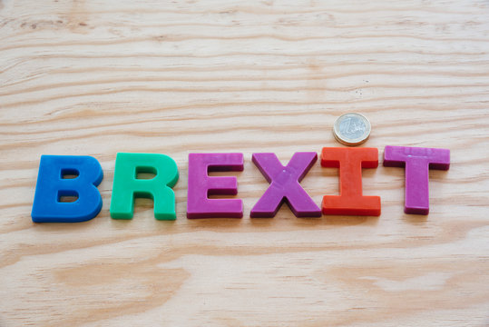 Brexit text on wooden background