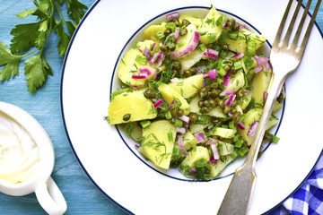 Healthy salad from new potato,capers,marinated onion and dill.
