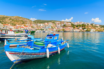 Fototapeta na wymiar Traditional blue and white colour Greek fishing boat in Pythagorion port, Samos island, Greece