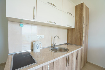 Interior of a guest house room with kitchen