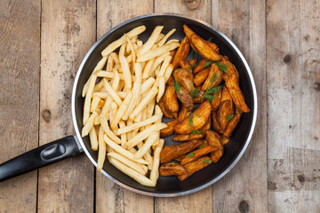 Potatoes fries on wood board