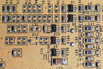 Printed board of computer component with electronic elements, closeup
