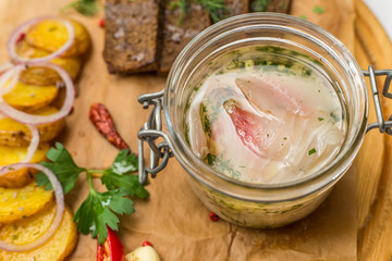herring salad with vegetables on desk top view potato onion