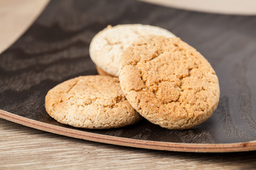 Cookies on wooden table. Stacked chip cookies shot closeup. Selective focus.