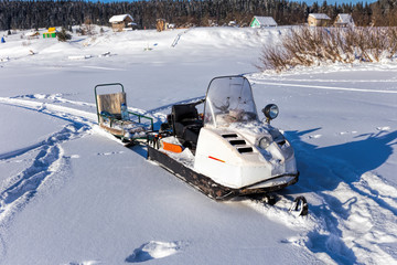 Russian snowmobile and sleigh - obrazy, fototapety, plakaty