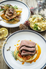 Baked chicken and beef with lemon and rosemary