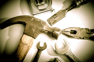 Construction tools abstraction with dramatic studio lighting.