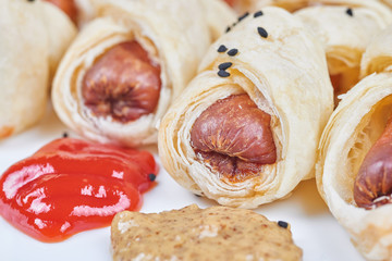 Sausages baked in a puff pastry