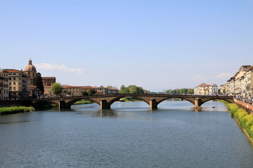 Urban landscape with bridge over river Arno in Florence, Italy