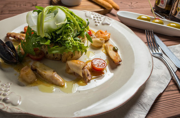 Various Seafood Salad on wooden table
