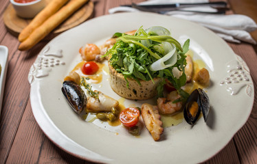 Various Seafood Salad on wooden table