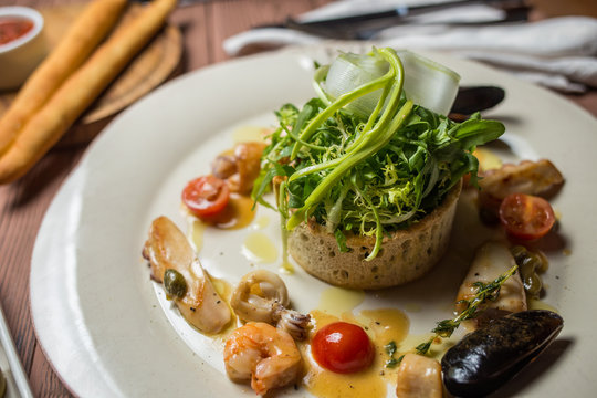 Various Seafood Salad on wooden table