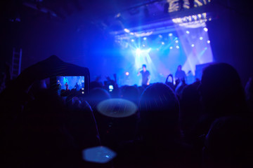 Silhouettes of people and musicians