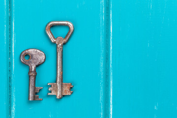 old key on a blue wooden background