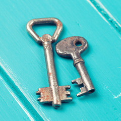 old key on a blue wooden background