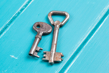 old key on a blue wooden background