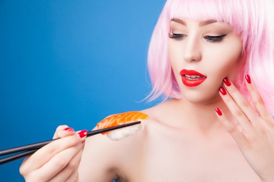 Beautiful girl with red lips and pink hair