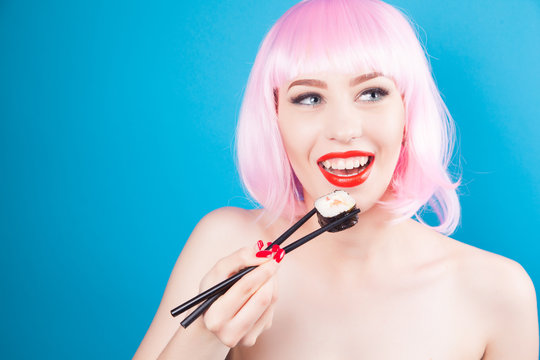 Beautiful girl with red lips and pink hair