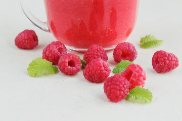 Delicious raspberry smoothie or milk shake with fresh berries. F