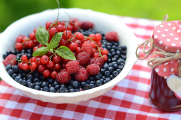 Fresh berries and raspberry jam, served in the garden