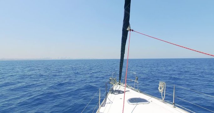 Sailing in the wind through the waves (4K) Sailing boat shot in 4K at the Mediterranean sea.Israel.
